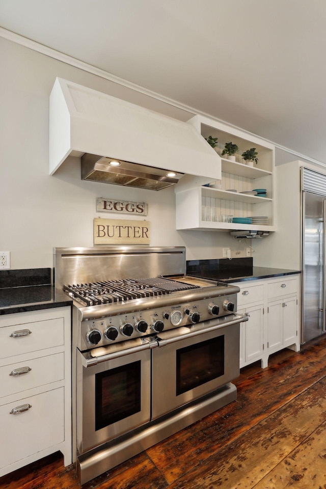 kitchen featuring white cabinetry, dark hardwood / wood-style flooring, custom exhaust hood, and high quality appliances