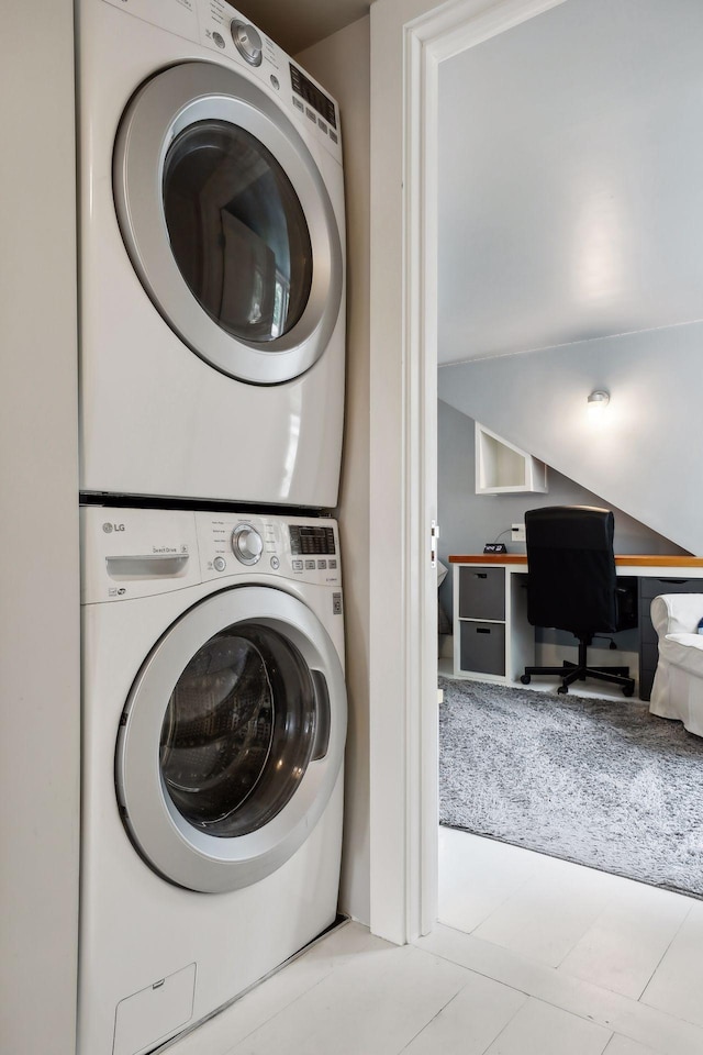 laundry room with stacked washer / drying machine