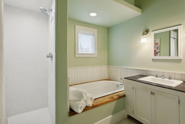 bathroom with independent shower and bath and vanity