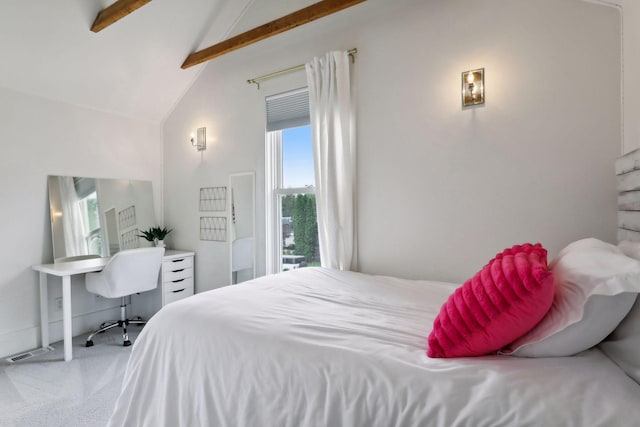 carpeted bedroom featuring lofted ceiling with beams