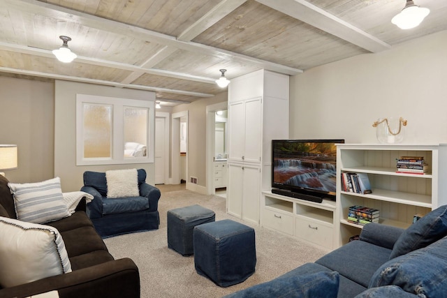 carpeted living room featuring wood ceiling and beam ceiling