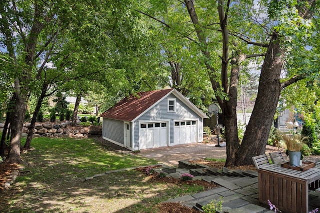 garage featuring a yard