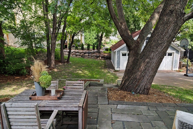 view of yard featuring a storage shed and a patio area