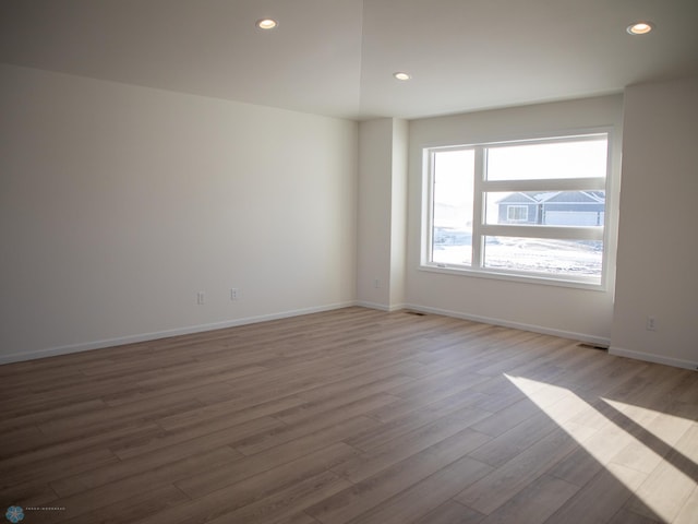 empty room featuring hardwood / wood-style flooring