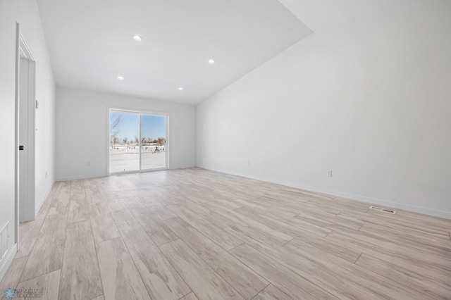 spare room with light wood-style flooring, visible vents, baseboards, and recessed lighting