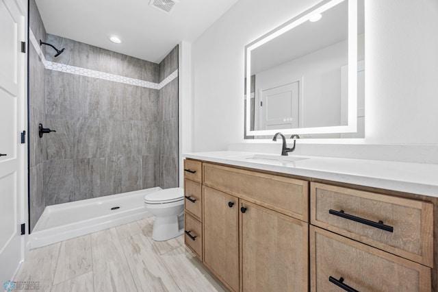 69 Cedar Dr, Mapleton, ND 58059 - full bath with toilet, vanity, and a tile shower