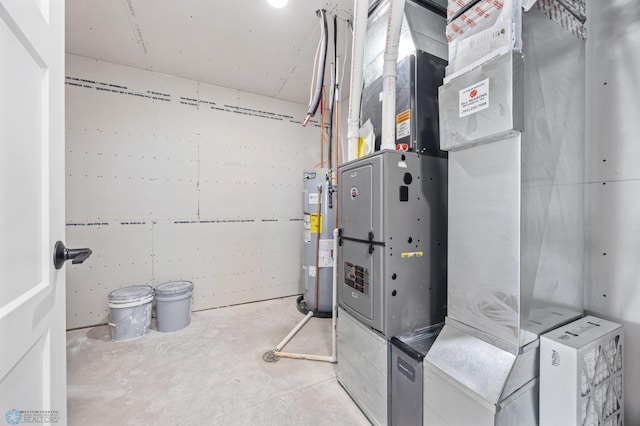 69 Cedar Dr, Mapleton, ND 58059 - utility room with electric water heater