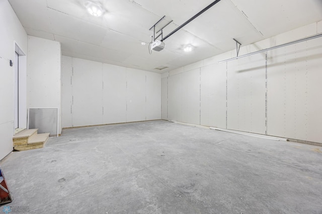 69 Cedar Dr, Mapleton, ND 58059 - garage featuring a garage door opener