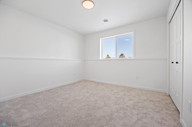 69 Cedar Dr, Mapleton, ND 58059 - unfurnished bedroom with a closet, carpet flooring, and baseboards