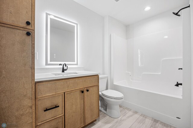 69 Cedar Dr, Mapleton, ND 58059 - bathroom featuring toilet, vanity, and shower / bath combination