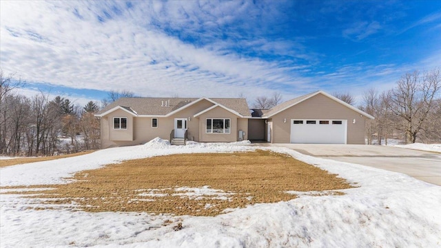 ranch-style house with driveway and an attached garage