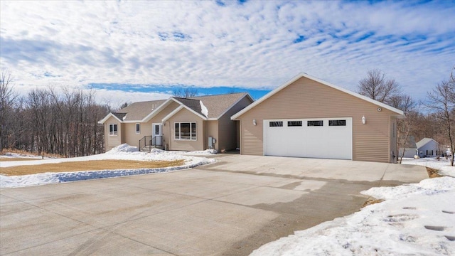 single story home featuring driveway and an attached garage