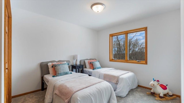 bedroom with carpet and baseboards