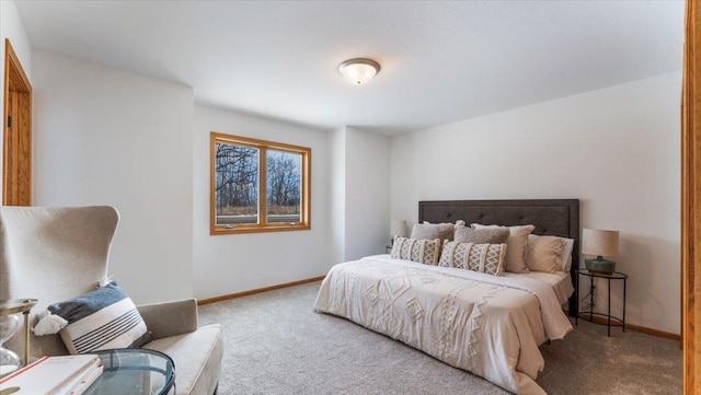 bedroom with carpet and baseboards