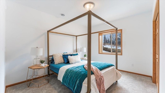 bedroom with carpet floors and baseboards