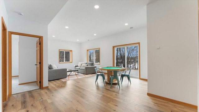 dining space with light wood-style floors, baseboards, and recessed lighting