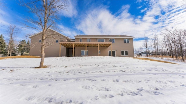 view of snow covered house