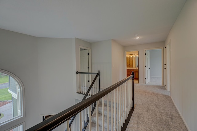 880 Norell Ave N, West Lakeland Twp, MN 55082 - hallway featuring an upstairs landing, light colored carpet, recessed lighting, and baseboards