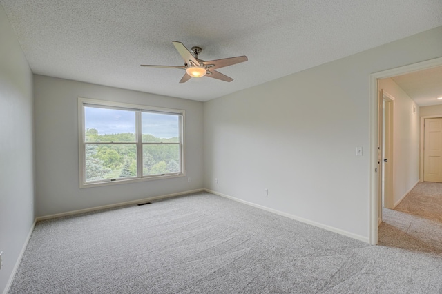 880 Norell Ave N, West Lakeland Twp, MN 55082 - carpeted empty room featuring a ceiling fan, a textured ceiling, and baseboards