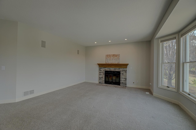 880 Norell Ave N, West Lakeland Twp, MN 55082 - unfurnished living room featuring carpet, recessed lighting, baseboards, and a fireplace