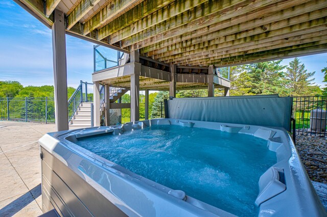 880 Norell Ave N, West Lakeland Twp, MN 55082 - view of swimming pool with stairway, a hot tub, and a patio area