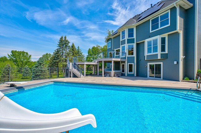 880 Norell Ave N, West Lakeland Twp, MN 55082 - view of pool with a jacuzzi, a water slide, stairway, a patio, and a diving board