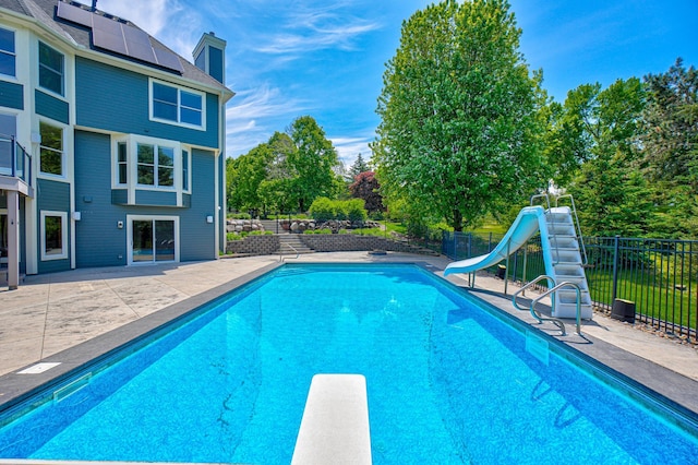 880 Norell Ave N, West Lakeland Twp, MN 55082 - view of pool with a water slide, a patio, and a diving board