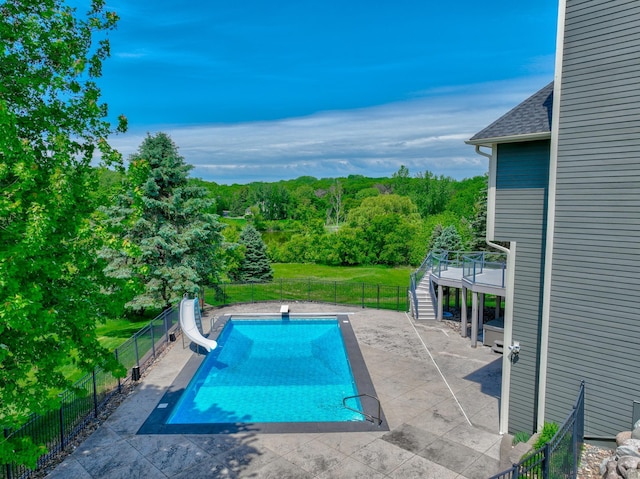 880 Norell Ave N, West Lakeland Twp, MN 55082 - view of swimming pool with a water slide, stairway, and a patio