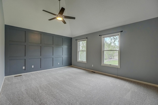 880 Norell Ave N, West Lakeland Twp, MN 55082 - carpeted empty room with a ceiling fan, baseboards, and high vaulted ceiling