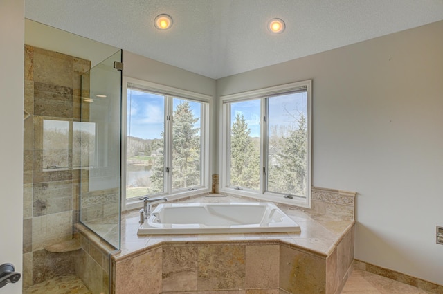 880 Norell Ave N, West Lakeland Twp, MN 55082 - bathroom with a bath, a tile shower, baseboards, and recessed lighting
