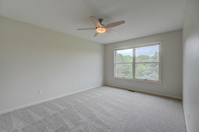 880 Norell Ave N, West Lakeland Twp, MN 55082 - carpeted spare room with a ceiling fan, a textured ceiling, and baseboards