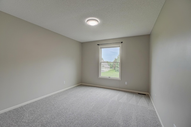 880 Norell Ave N, West Lakeland Twp, MN 55082 - spare room with light carpet, a textured ceiling, and baseboards