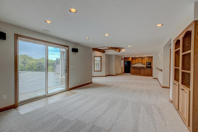 880 Norell Ave N, West Lakeland Twp, MN 55082 - unfurnished living room featuring light carpet, recessed lighting, baseboards, and a textured ceiling