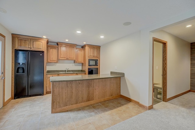 880 Norell Ave N, West Lakeland Twp, MN 55082 - kitchen with black appliances, a peninsula, recessed lighting, a sink, and baseboards
