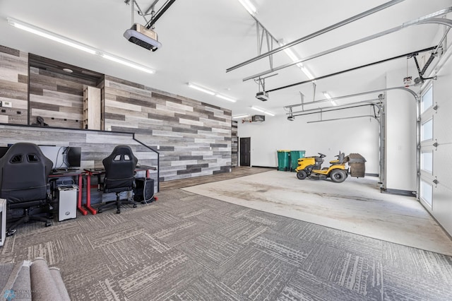 garage with an accent wall and a garage door opener