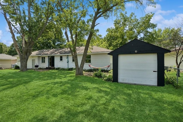 4345 Upper 145th St W, Rosemount, MN 55068 - rear view of property with a detached garage and an outbuilding