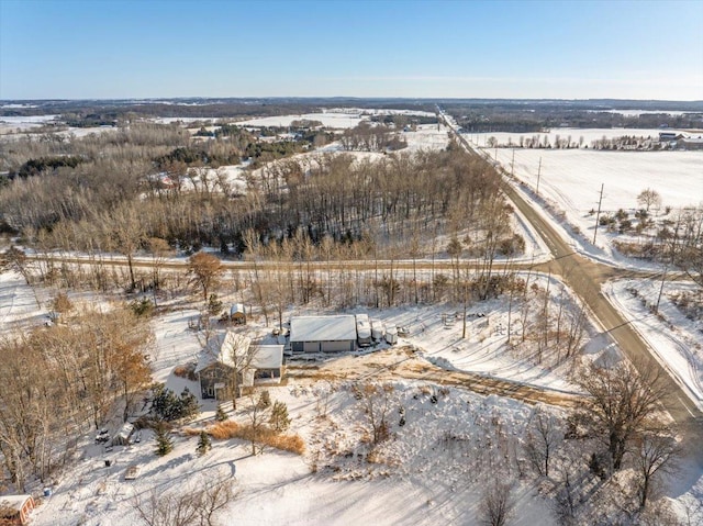 snowy aerial view featuring a rural view