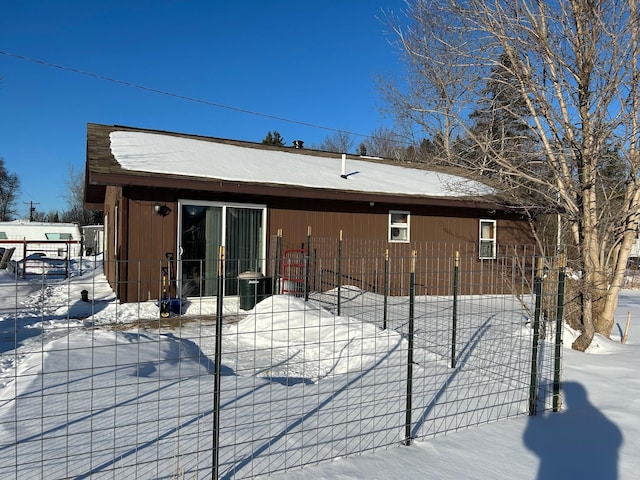 view of snow covered house