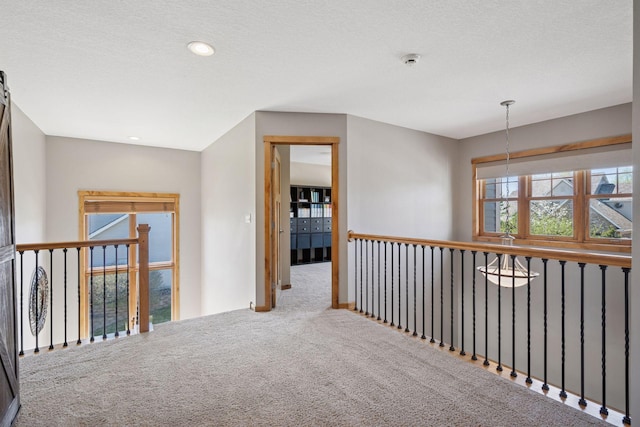 hall with carpet and recessed lighting