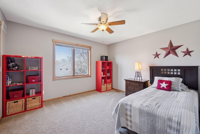 bedroom with baseboards, carpet flooring, a textured ceiling, and ceiling fan