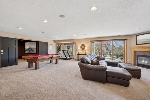 game room with a textured ceiling, pool table, light colored carpet, and recessed lighting