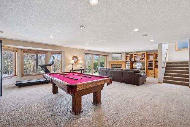 game room featuring light colored carpet, recessed lighting, a textured ceiling, and billiards