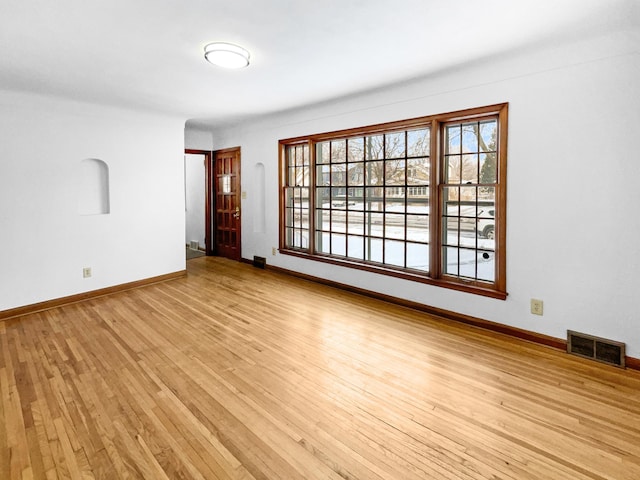 unfurnished room featuring light wood-type flooring