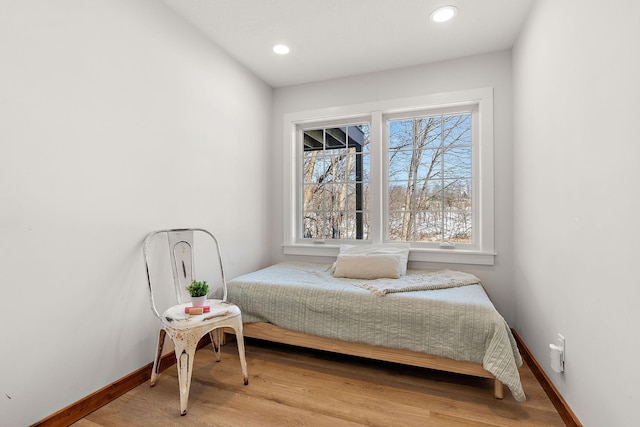 bedroom featuring recessed lighting, wood finished floors, and baseboards