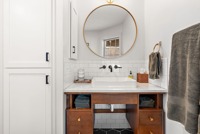 bathroom featuring backsplash and vanity