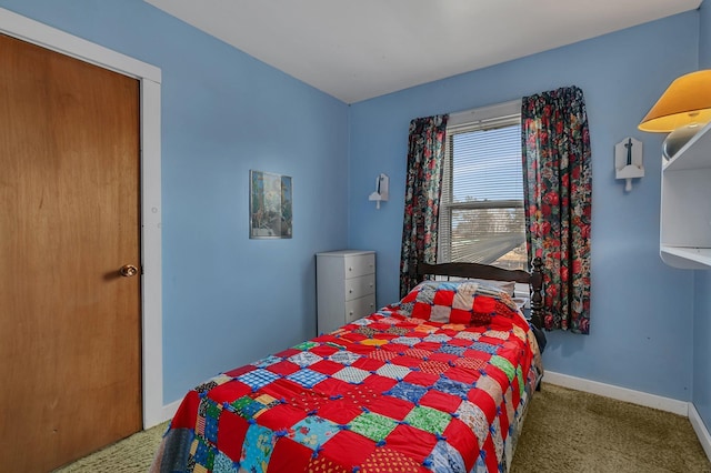 carpeted bedroom with baseboards