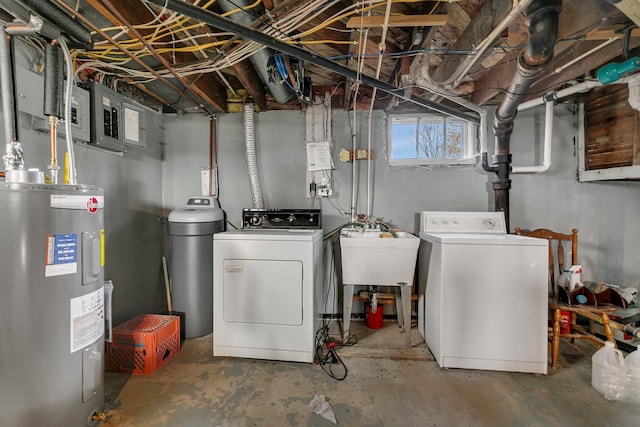 below grade area with a sink, water heater, and washing machine and clothes dryer