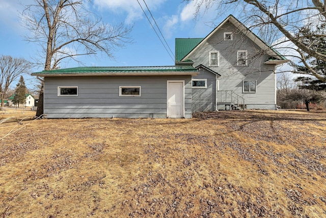 back of property with metal roof