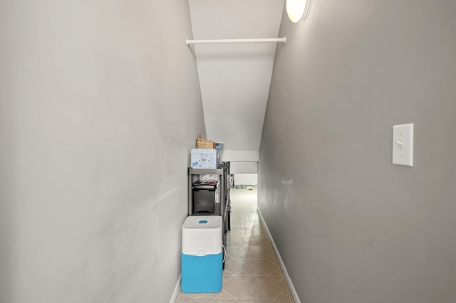 interior space with tile patterned floors and baseboards