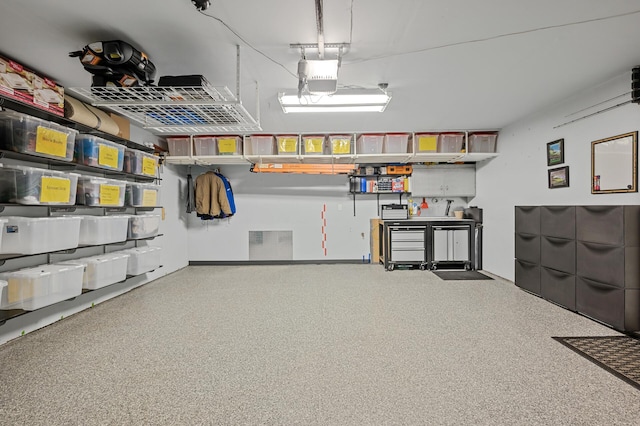 garage featuring a garage door opener and visible vents